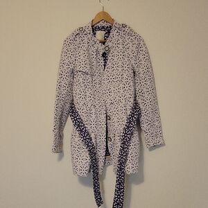 Elevenses by Anthropologie eyelet trench coat with a blue and white floral